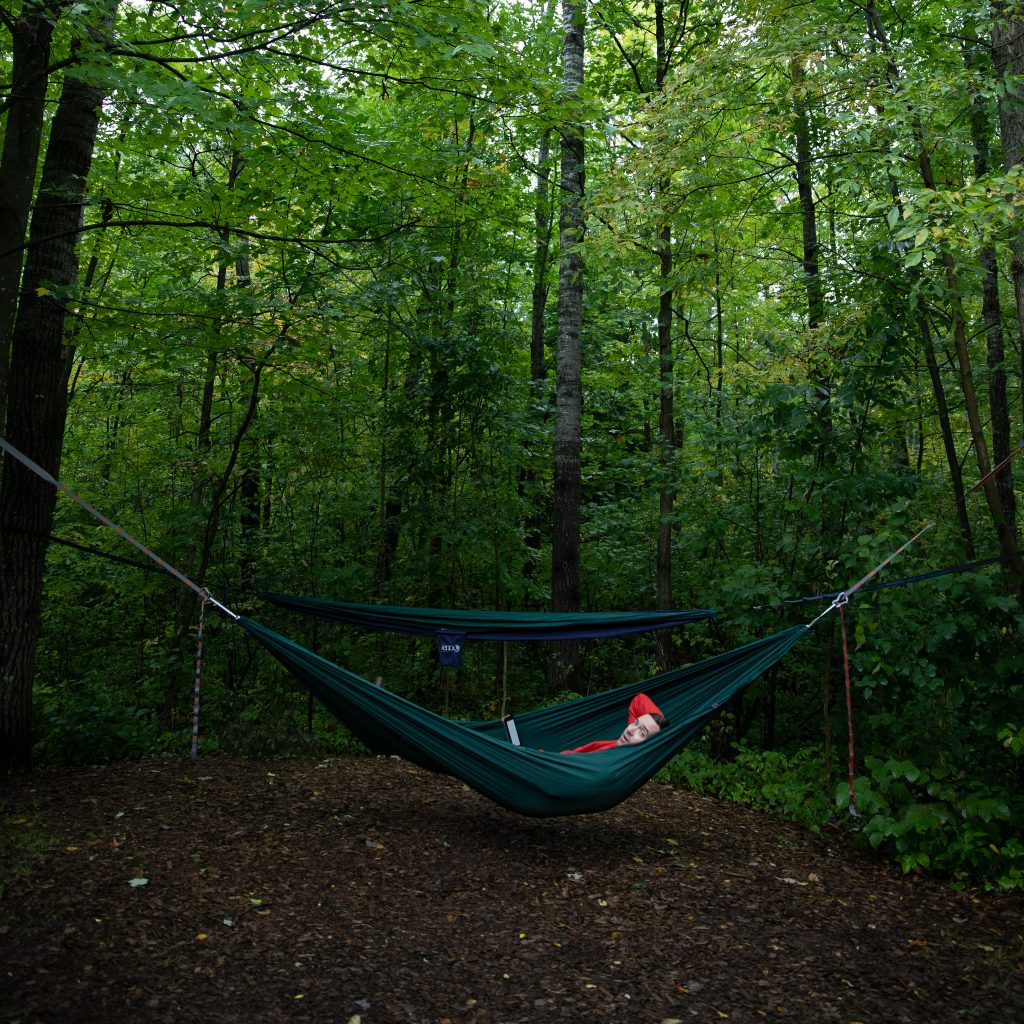 person laying in a hammock