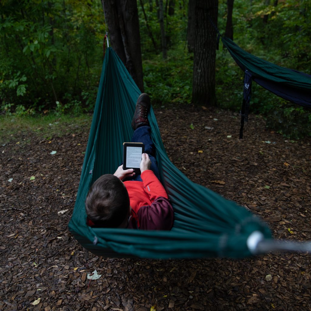 person laying in a hammock