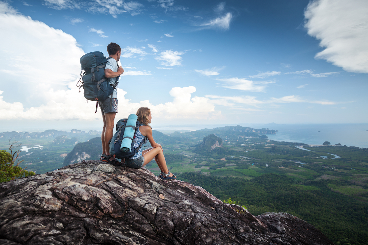 Hikers standing on top of the mountain