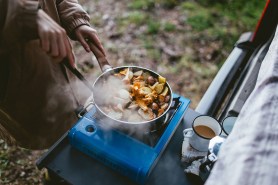 light titanium camping pot on a camping stove